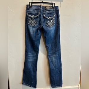 LAIdol bootcut.Size 9. Worn a couple times. No stains,tears or missing stones.